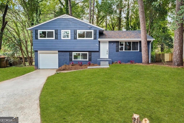 tri-level home with a front lawn and a garage