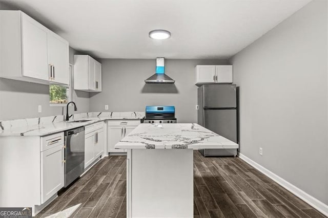 kitchen featuring a kitchen island, white cabinets, appliances with stainless steel finishes, and extractor fan