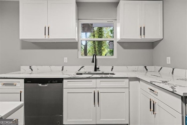 kitchen featuring sink, white cabinetry, stainless steel dishwasher, and light stone countertops