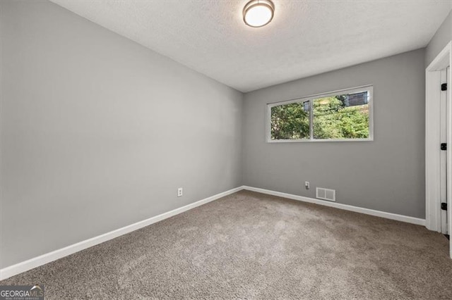 empty room featuring carpet floors