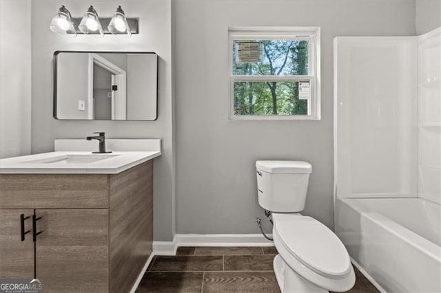 full bathroom with toilet, bathing tub / shower combination, and vanity