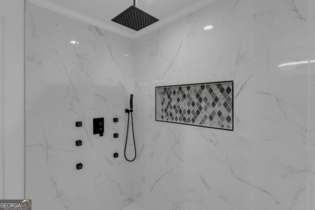 interior details featuring tiled shower and ornamental molding