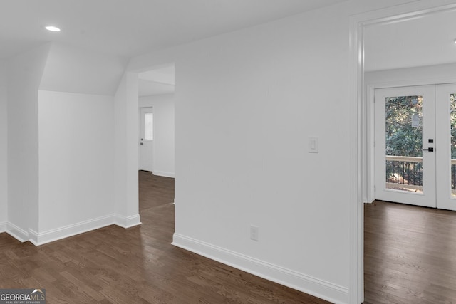 interior space with french doors, dark hardwood / wood-style flooring, and vaulted ceiling