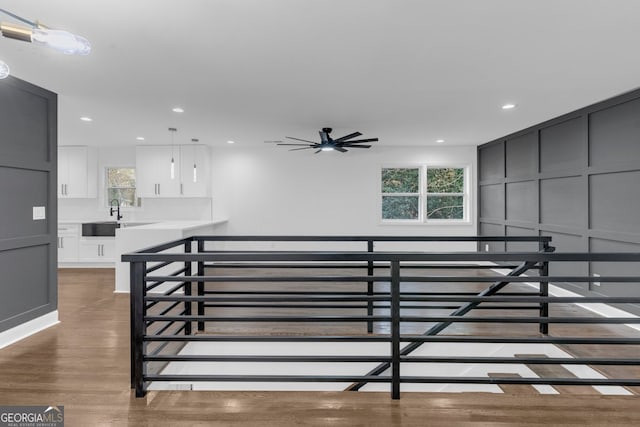 staircase with hardwood / wood-style flooring