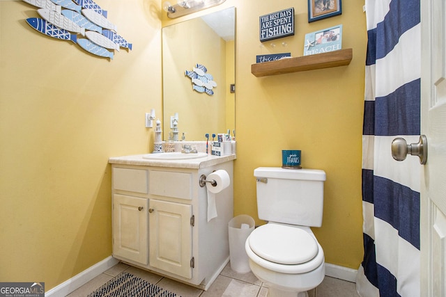 bathroom with tile patterned flooring, vanity, toilet, and a shower with curtain