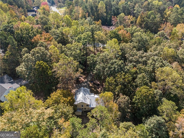 drone / aerial view featuring a view of trees