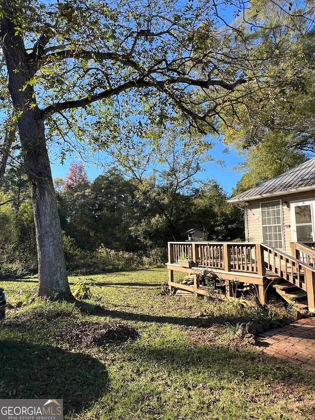 view of yard with a wooden deck