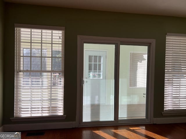 doorway featuring dark hardwood / wood-style flooring