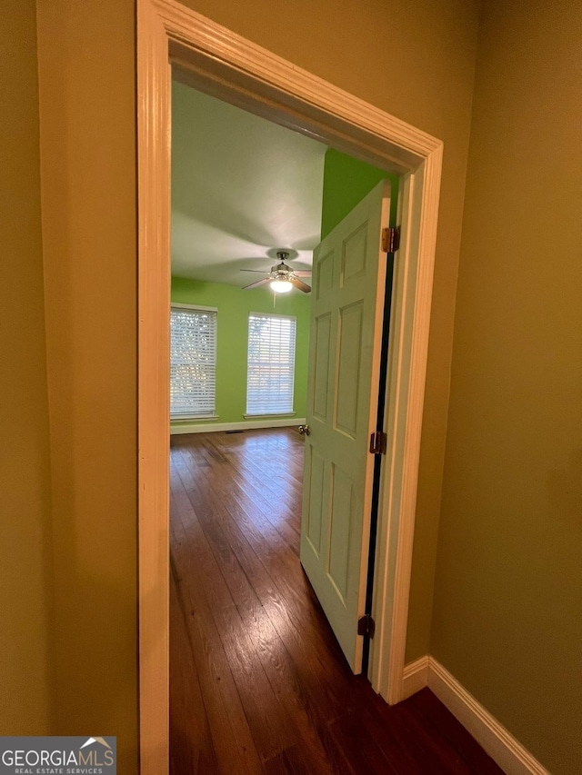 hallway with wood-type flooring