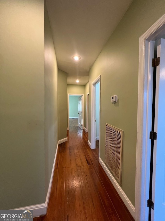 corridor featuring dark hardwood / wood-style floors