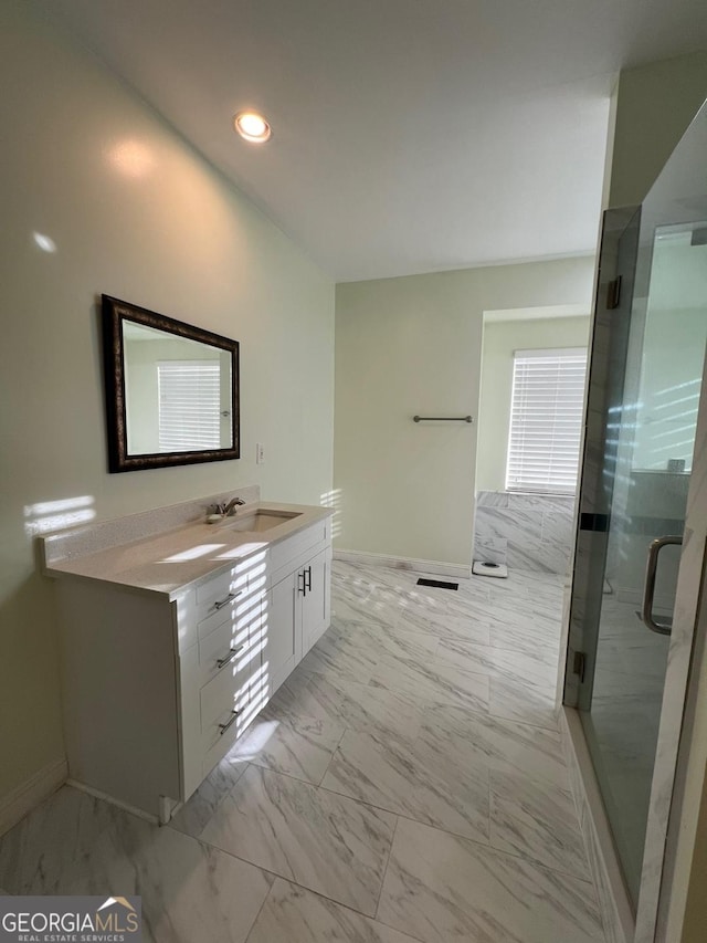 bathroom featuring vanity and walk in shower