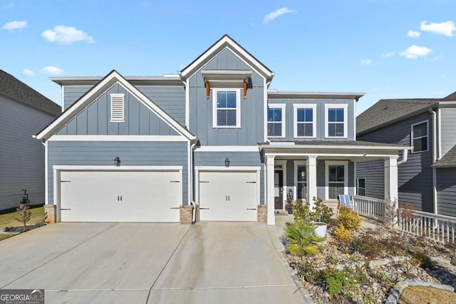 view of front of home with a porch and a garage