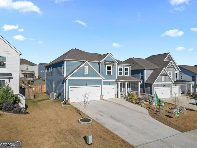 view of front of home with central AC unit, a garage, and a front yard