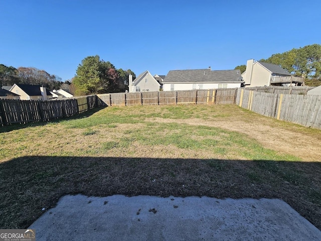 view of yard with a fenced backyard