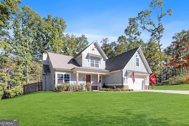 view of front of property with a front yard and a garage