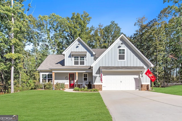 view of front of property with covered porch, a garage, and a front lawn