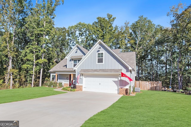 craftsman house with central AC, a front yard, and a garage