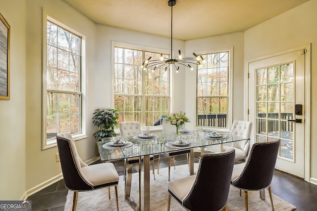 dining area featuring a chandelier and dark hardwood / wood-style flooring