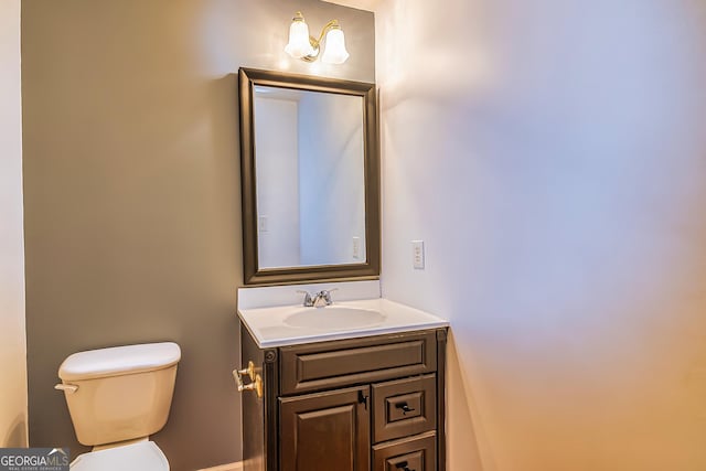 bathroom with vanity and toilet