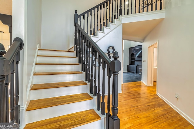 staircase featuring hardwood / wood-style flooring