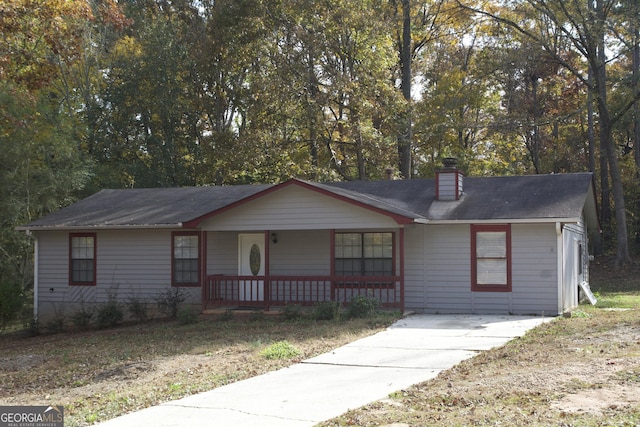 single story home with a porch