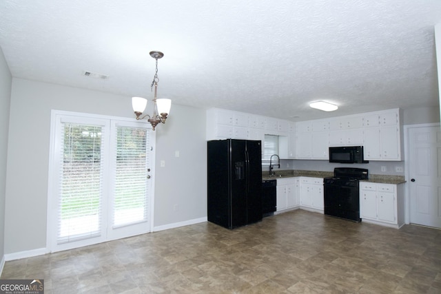 kitchen featuring sink, an inviting chandelier, decorative light fixtures, white cabinets, and black appliances