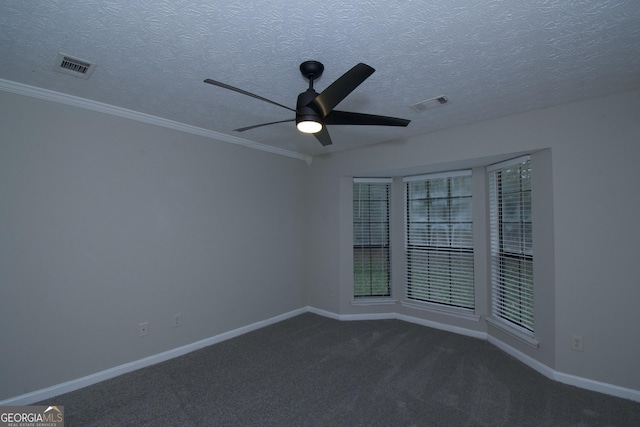 carpeted empty room with a textured ceiling, ceiling fan, and crown molding