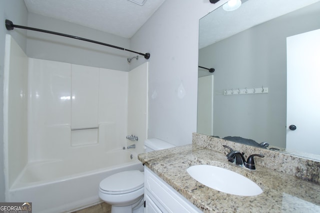 full bathroom featuring shower / bathtub combination, vanity, a textured ceiling, and toilet