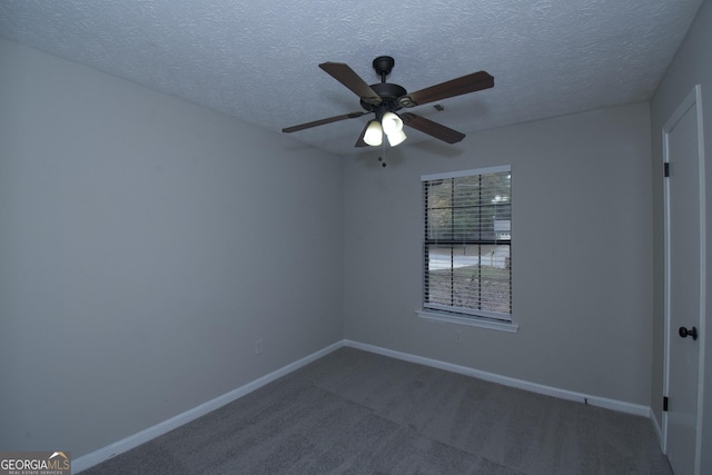 carpeted empty room with a textured ceiling and ceiling fan