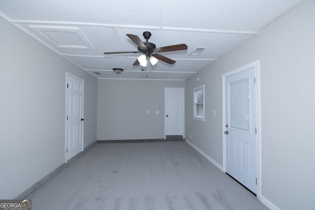 empty room with light colored carpet and ceiling fan