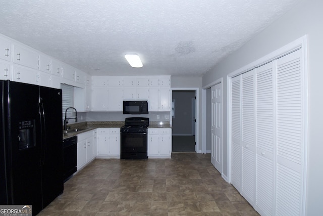 kitchen with sink, white cabinets, black appliances, and a textured ceiling