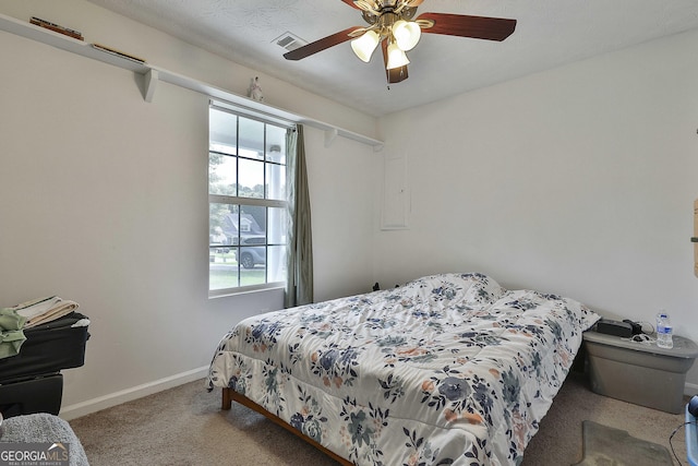 bedroom with ceiling fan and light colored carpet