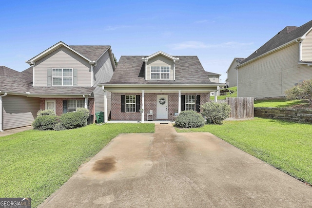 view of front of property with a porch and a front lawn