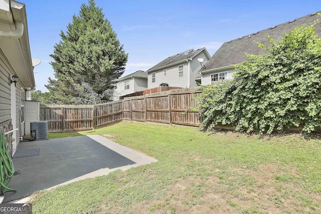 view of yard featuring a patio and central AC