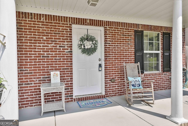 entrance to property with covered porch