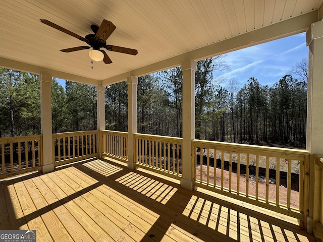 wooden terrace featuring ceiling fan