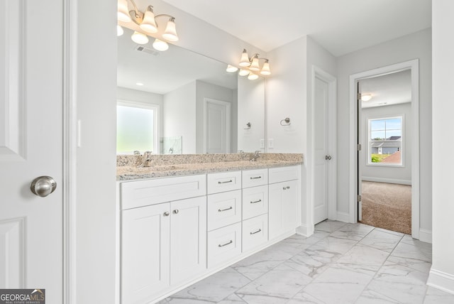 553 Lago Ct, Lagrange, GA 30241 - bathroom with a sink, double vanity, marble finish floor, baseboards, and visible vents