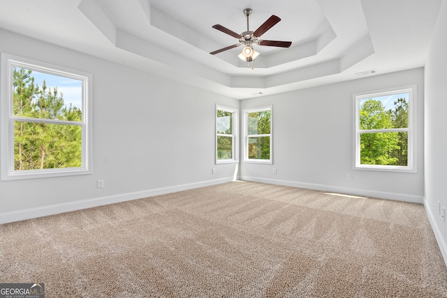 553 Lago Ct, Lagrange, GA 30241 - unfurnished room with visible vents, carpet floors, baseboards, ceiling fan, and a raised ceiling