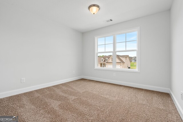 553 Lago Ct, Lagrange, GA 30241 - empty room featuring carpet floors, baseboards, and visible vents