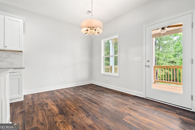 553 Lago Ct, Lagrange, GA 30241 - unfurnished dining area featuring baseboards, visible vents, dark wood finished floors, and a notable chandelier
