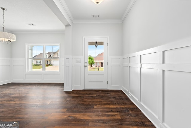 553 Lago Ct, Lagrange, GA 30241 - entrance foyer featuring crown molding, an inviting chandelier, a decorative wall, a wainscoted wall, and visible vents