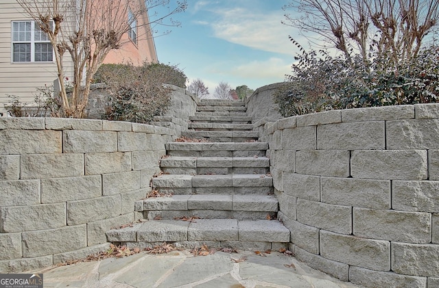 exterior details featuring fence and stairs