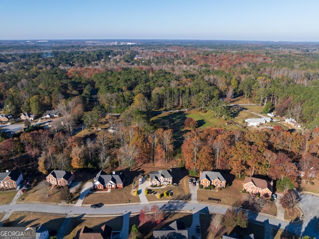 birds eye view of property with a residential view and a wooded view