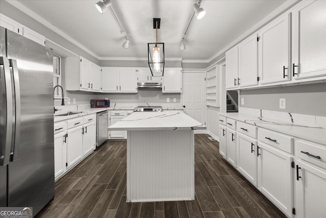 kitchen featuring appliances with stainless steel finishes, dark hardwood / wood-style flooring, a kitchen island, white cabinetry, and hanging light fixtures