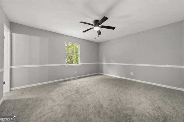 empty room with carpet flooring and ceiling fan