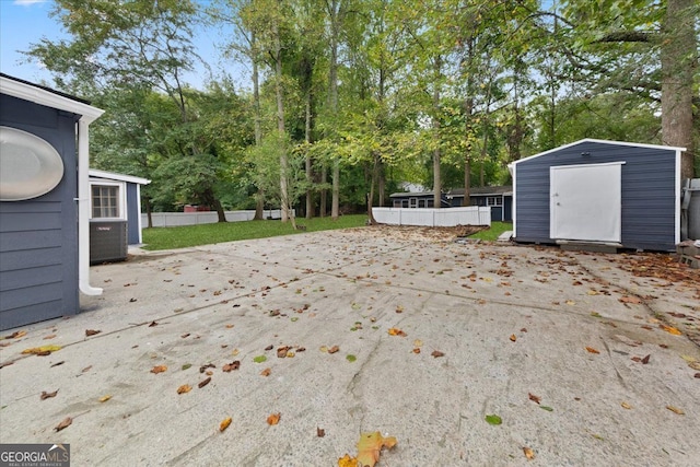 view of patio with a shed