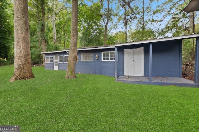 view of outdoor structure with a lawn