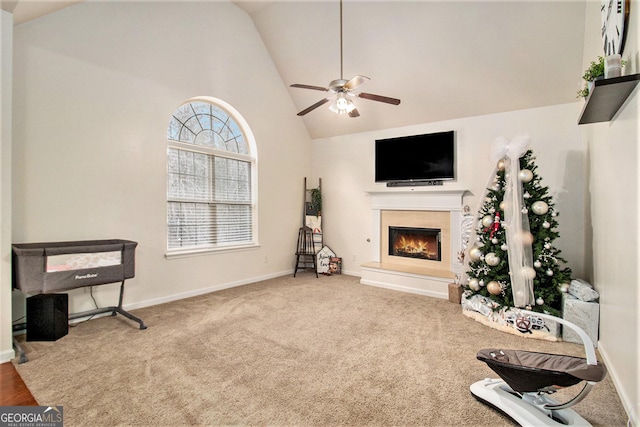 interior space featuring carpet, ceiling fan, and high vaulted ceiling