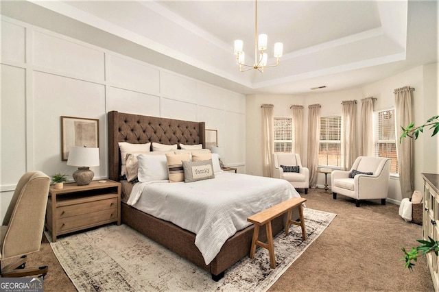 bedroom with light carpet, an inviting chandelier, and a tray ceiling