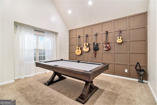 playroom with high vaulted ceiling, a decorative wall, light carpet, pool table, and baseboards